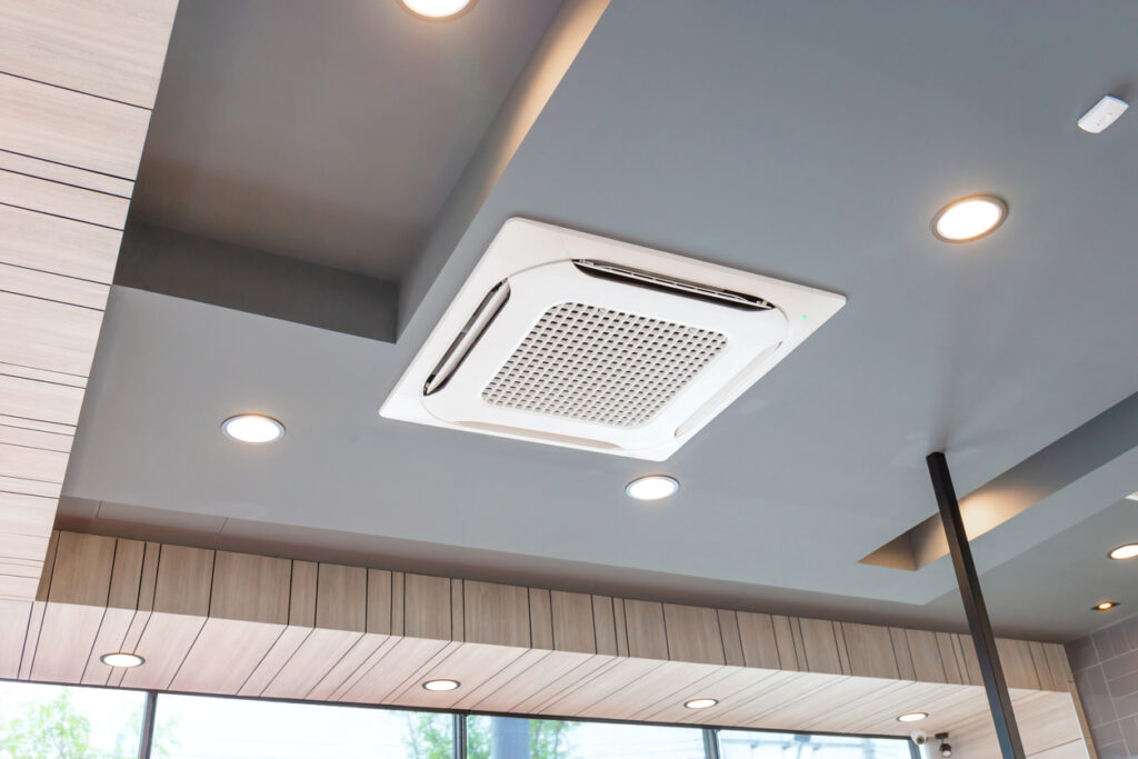 Ceiling Cassette Air Conditioning System on a grey ceiling